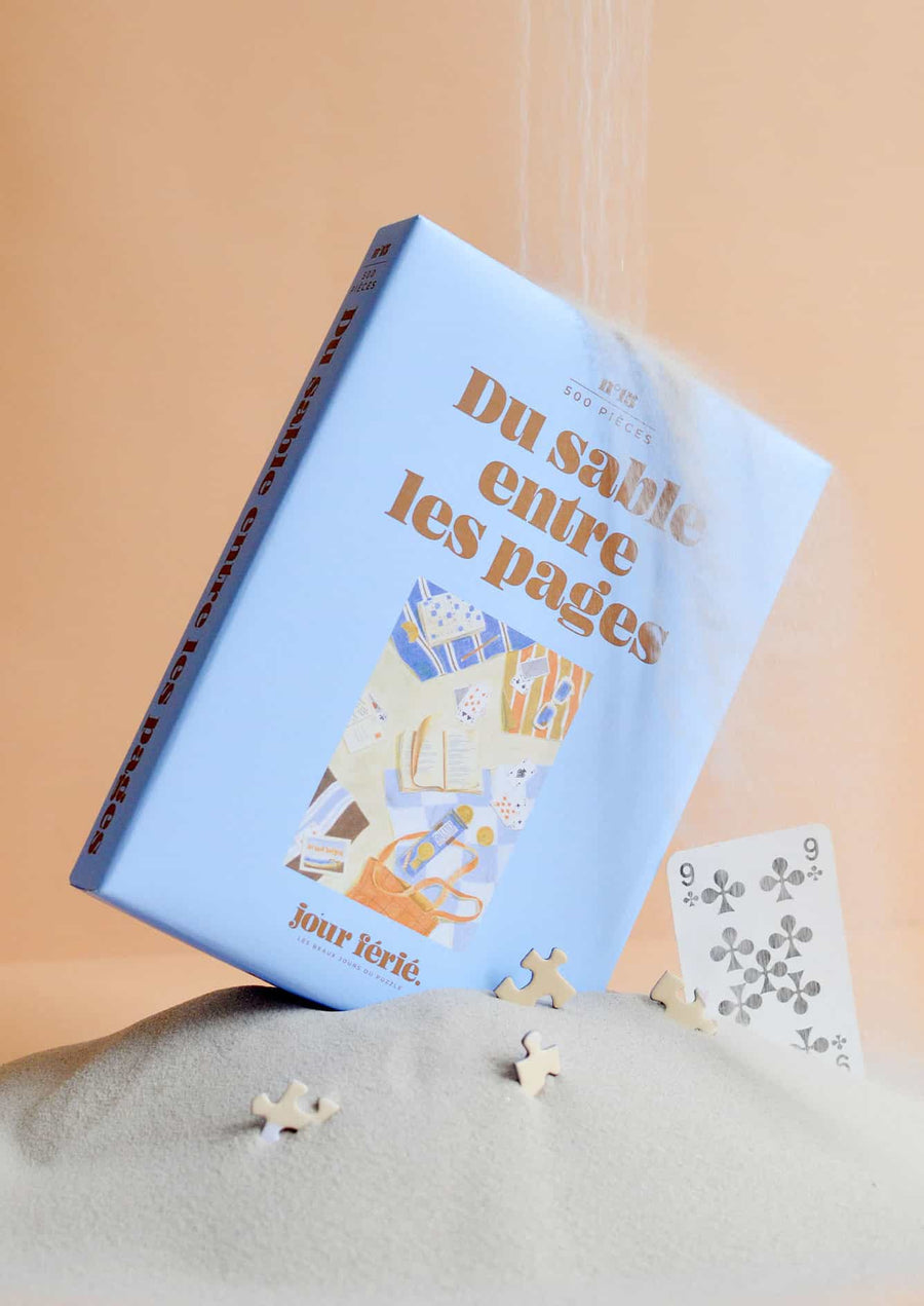 Dėlionė. Du sable entre les pages